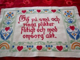 En Fin Handbroderad Bonad i Linne och Glada Färger!