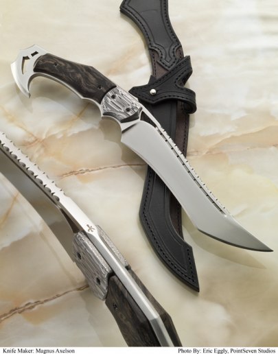 Hooked Fighter - D2 steel with Damasteel bolsters and Silvervine scales. Leather-lined openspine sheath.