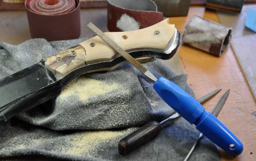 Rough shaping the scales and bolsters with a small rasp.